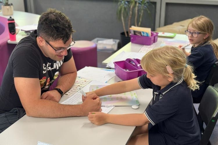 Teacher with student